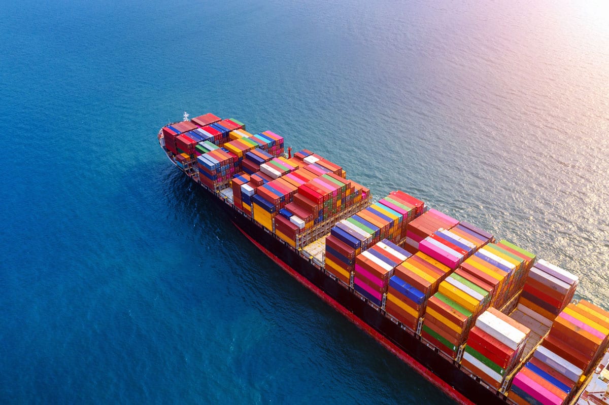 Cargo ship in the open sea, representing Global Corporate Logistics as a reliable sea freight service and freight forwarding agent in Manchester, specializing in shipping and sending containers worldwide