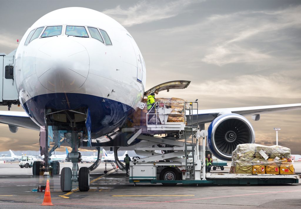 Team of international couriers coordinating air cargo to Nigeria for timely, secure delivery.